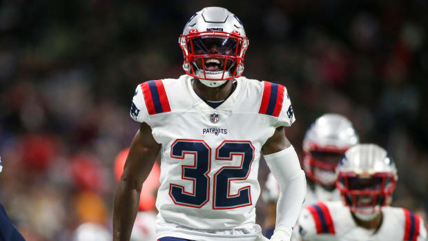 Patriots safety Devin McCourty (32) celebrates after an interception against the Falcons.